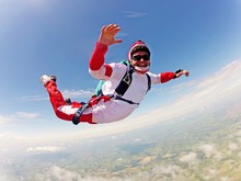 Red Skydiver. Classic Position Free Fall