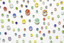 Collection Of Colorful Glass Marbles Against A White Background