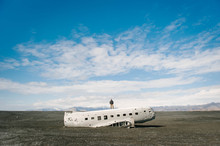 Man Standing On Abandoned Plane