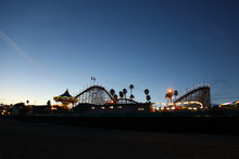 Night Time Scene Of An Amusement Park On The Beach