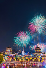 Fireworks At Lotus Pond Behind Guanyin Statue Riding A Dragon In The Front End Of The Spring And Autumn Pavilions Opposite To Chi Ming Palace At Night Time With Blue Twilight Sky In Kaosiung, Taiwan