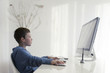 © Marija Anicic/Stocksy - Boy is playing game on the computer