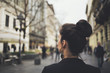 © Lumina/Stocksy - Woman With a Bun on the Street