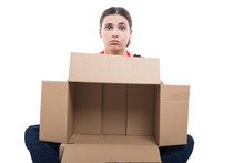 Unhappy Woman Employee Holding Empty Box