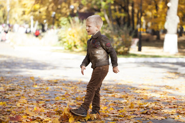 Portrait of a young boy in pilot leather jacket