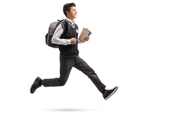 Wall Mural - Teenage student with a backpack and books in mid-air