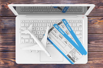 Poster - Online Booking Concept. Airline Boarding Pass Tickets with Jet Airplane over Laptop over Wooden Table. 3d Rendering