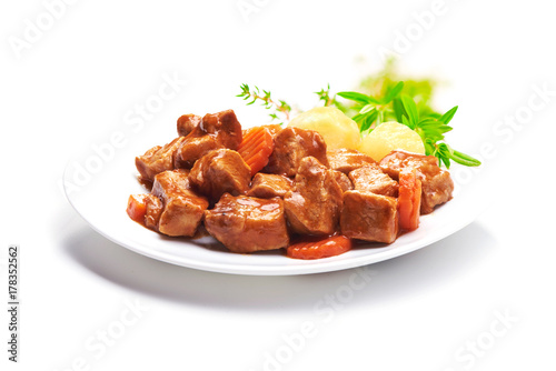 Fotografie, Obraz Goulash, beef stew with potatoes, isolated on white background