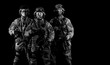 © andy_gin - Three soldiers in uniform with a weapon in their hands are looking menacingly.