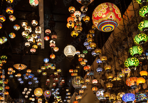 Multicolored Oriental Lamps Hanged From The Ceiling Lighted Glass