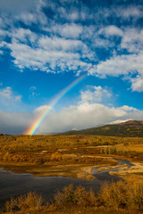 Wall Mural - Rainbow on an autumn day near Saint Mary, Glacier National Park,