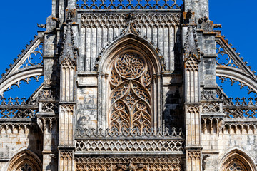 Wall Mural - Details of the facade of the 14th century Batalha Monastery in Batalha, Portugal, a prime example of Portuguese Gothic architecture, UNESCO World Heritage site.