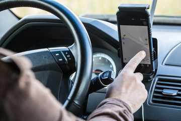 Wall Mural - Driver in the car controls the navigator