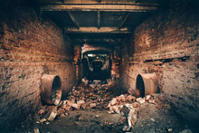 Old Dark Creepy Underground Brick Tunnel Or Corridor Or Sewer Pipeline At Abandoned Ruined Industrial Factory