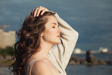 Wall Mural - Perfect Woman with Long Curly Hair and Natural Makeup Outdoors