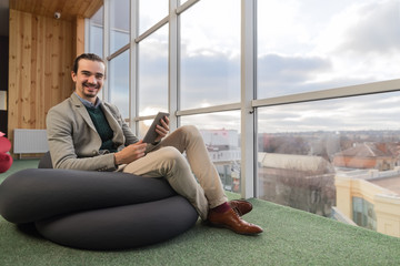 Canvas Print - Business Man Using Cell Smart Phone Sit In Front Panoramic Window Businessman Coworking Center Office Interior