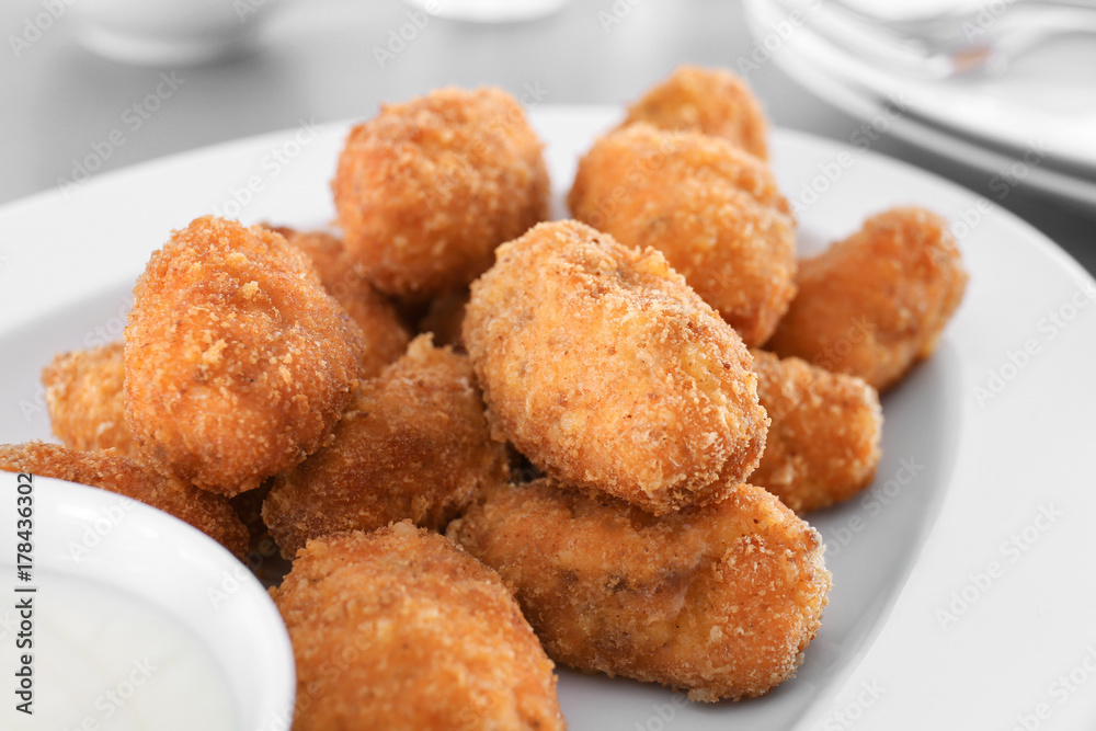Delicious salmon croquettes on plate, closeup