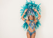 Beautiful and cheerful brazilian samba dancer performing and posing