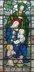 Wall Mural - LONDON, GREAT BRITAIN - SEPTEMBER 17, 2017: The Holy Family on the stained glass in church Holy Trinity Brompton.