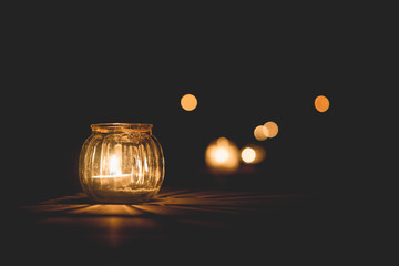 candle light in glass small jar