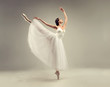 © Sofia Zhuravetc - Ballerina. Young graceful woman ballet dancer, dressed in professional outfit, shoes and white weightless skirt is demonstrating dancing skill. Beauty of classic ballet.