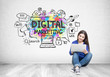 Teenage girl in jeans, a laptop, digital marketing