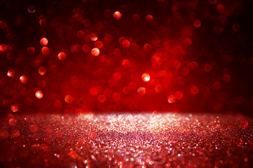 Red glitter vintage lights background. defocused.