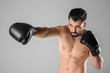 © Africa Studio - Male boxer on light background