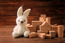 Wooden Blocks With Toy Bunny For Kindergarten On Table