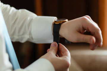 Wall Mural - Businessman in white shirt wearing expensive watches