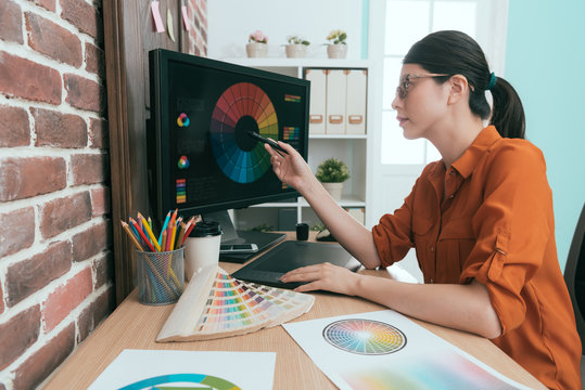 graphic worker using digital pad pen pointing