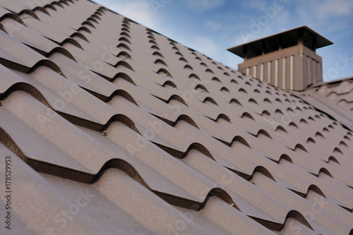 Metal Roof Construction Against Blue Sky Roofing Materials