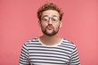 © wayhome.studio - Funny male with curly trendy hairstyle, rounds lips as going to kiss someone, looks in anticipation, isolated over pink background. Fashionable bearded man epresses positive emotions, makes grimace