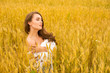 © Andrey_Arkusha - Portrait of a young girl on a background of golden wheat field