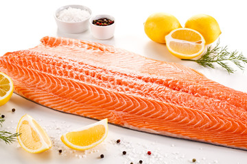 Raw salmon fillet on white background