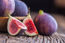 Figs. A Few Figs In A Bowl On An Old Wooden Background