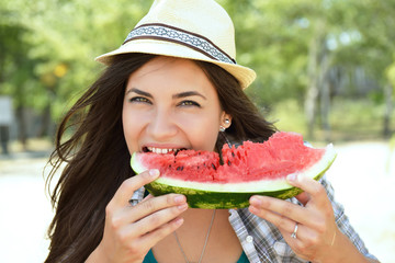 Wall Mural - Happy young woman eating watermelon on the beach. Youth lifestyle. Happiness, joy, holiday, beach, summer happiness concept.