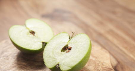 Wall Mural - green apple on wood board