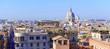 Panorama Cityscape with elevated view of city and commercial and residential buildings with tile rooftops in Rome, Italy