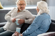 © Yakobchuk Olena - Happy mature couple drinking coffee together at home