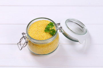 Canvas Print - jar of raw millet grains