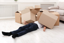 Man Crushed Underneath Cardboard Boxes