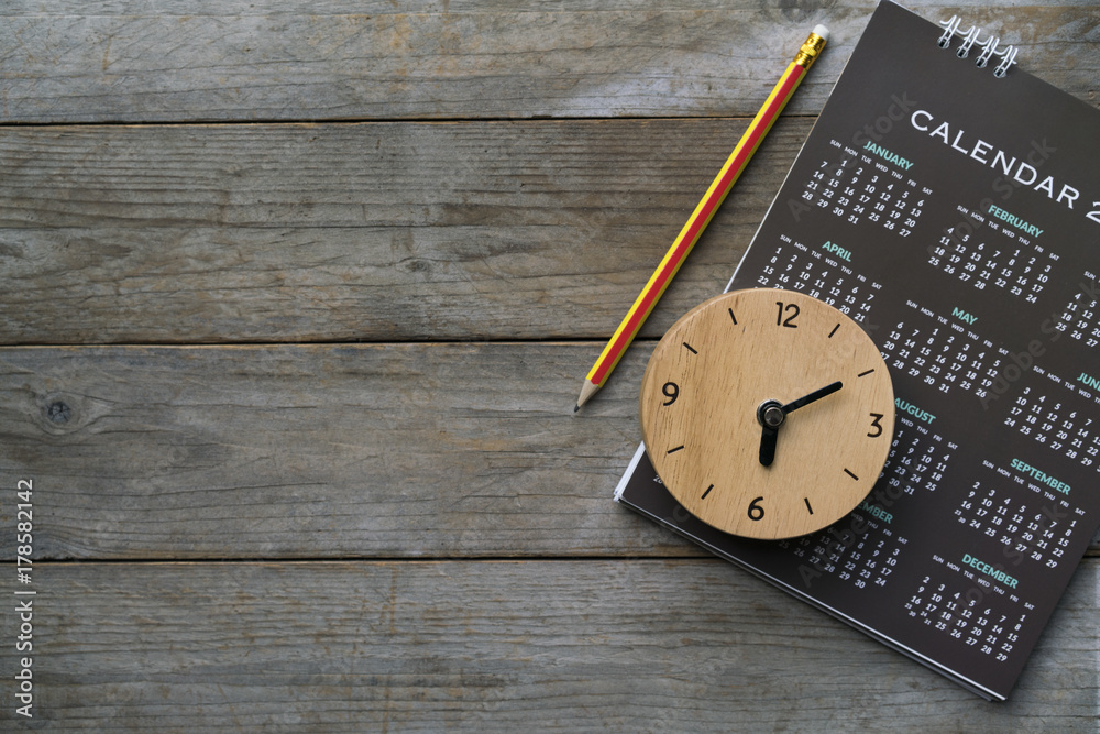 close up of clock, calendar and pencil on the table, planning for business meeting or travel planning concept - obrazy, fototapety, plakaty 