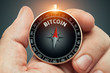 © Myst - hand holding compass and needle pointing bitcoin word