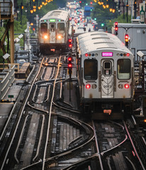 Train on elevated tracks within buildings at the Loop, Chicago City Center - Soft Warm Artistic Effect - Chicago, Illinois, USA