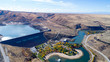 Idaho Dam in the desert with autumn trees in a park at the base