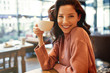 woman drinking coffee in a cafe