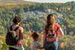 family enjoying the view of autumn colors from scenic overlook at Devil's Lake State Park in Wisconsin