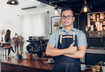 Poster - Male Barista thumbs up in front on cafe counter bar with customer sitting inside coffee shop,Good owner food and drink business,success shop