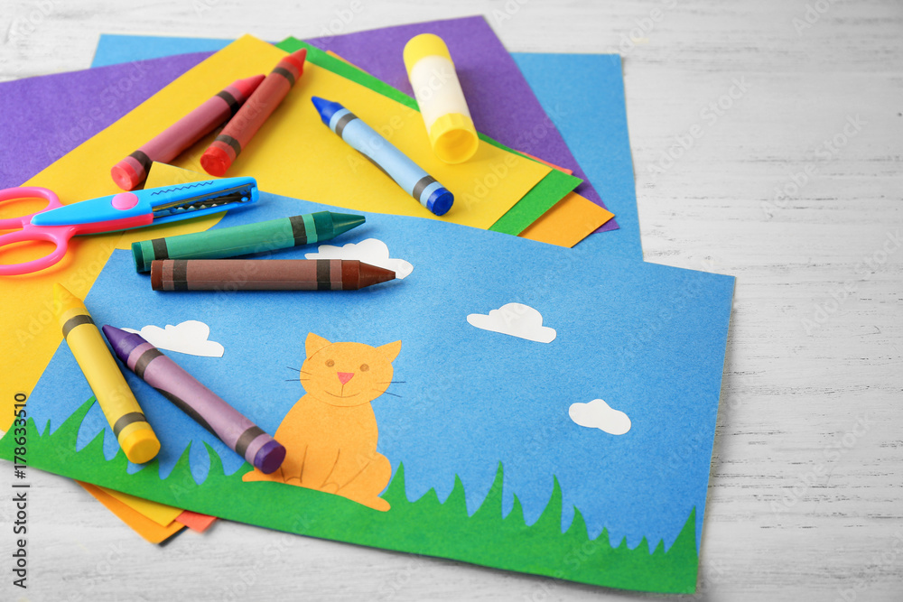 Adorable childish applique and many colorful pencils on table